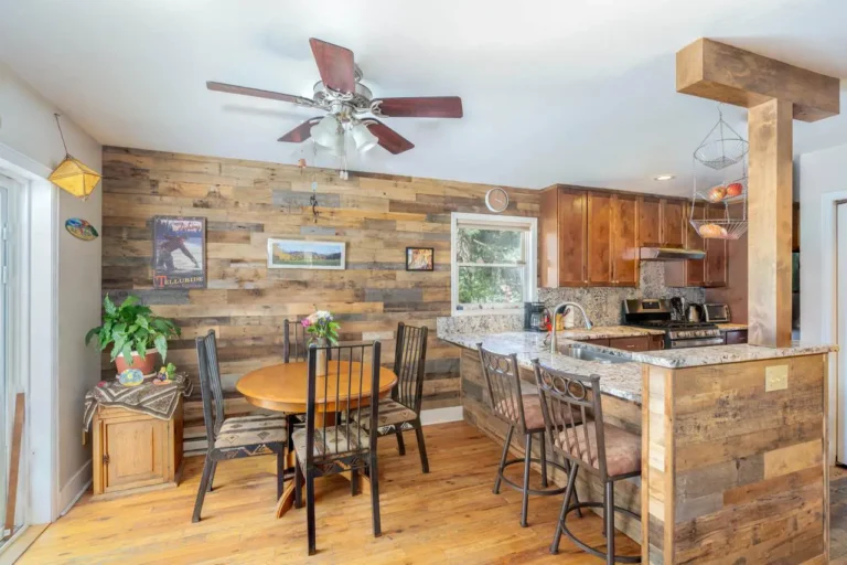 Real estate listing 19 Beeslack Lane, Telluride warm interior dining area and kitchen.