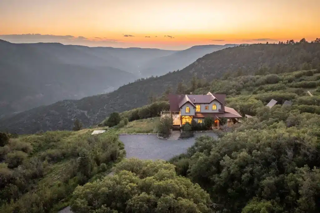 462 Dragon Lode Drive aerial sunset with illuminated home.