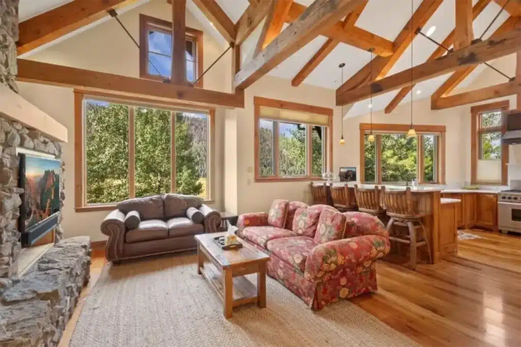 Shimkonis Partners Telluride real estate listing, 210 S Sunset Ridge, bright, airy interior living space with verdant, summer views