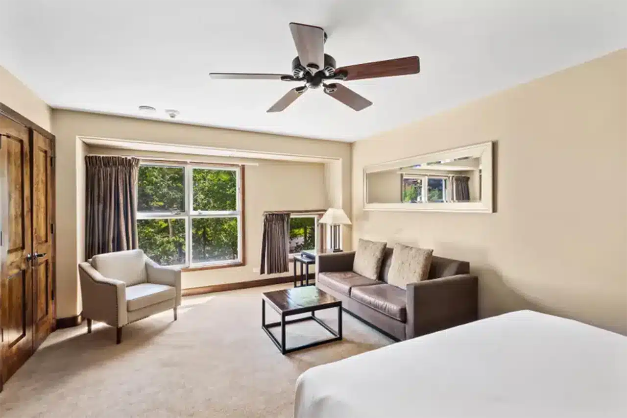 Bright interior of Shimkonis Partners real estate listing, Peaks condo 333, with verdant summer view.