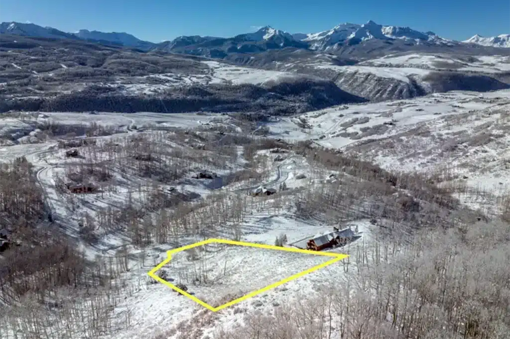 Telluride real estate listing Christina’s Way Aldasoro neighborhood property aerial view with bluebird, snowy mountain views and property outline.