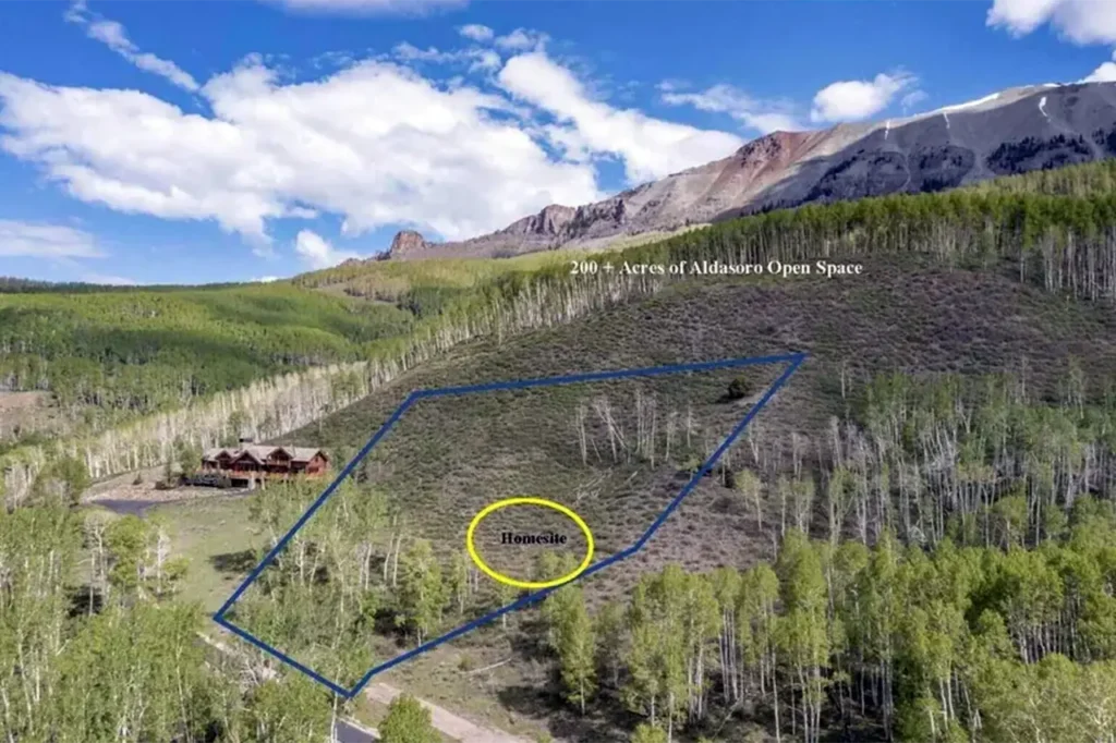 Telluride real estate listing Christina’s Way Aldasoro neighborhood property aerial view with bluebird, summer mountain views and property and home site outlines.