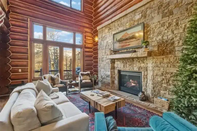 304 Prospect Falls Ct, Mountain Village Bright living area of Shimkonis Partners Telluride area real estate listing, 304 Prospect Falls Ct, Mountain Village, with mountain views and fireplace.