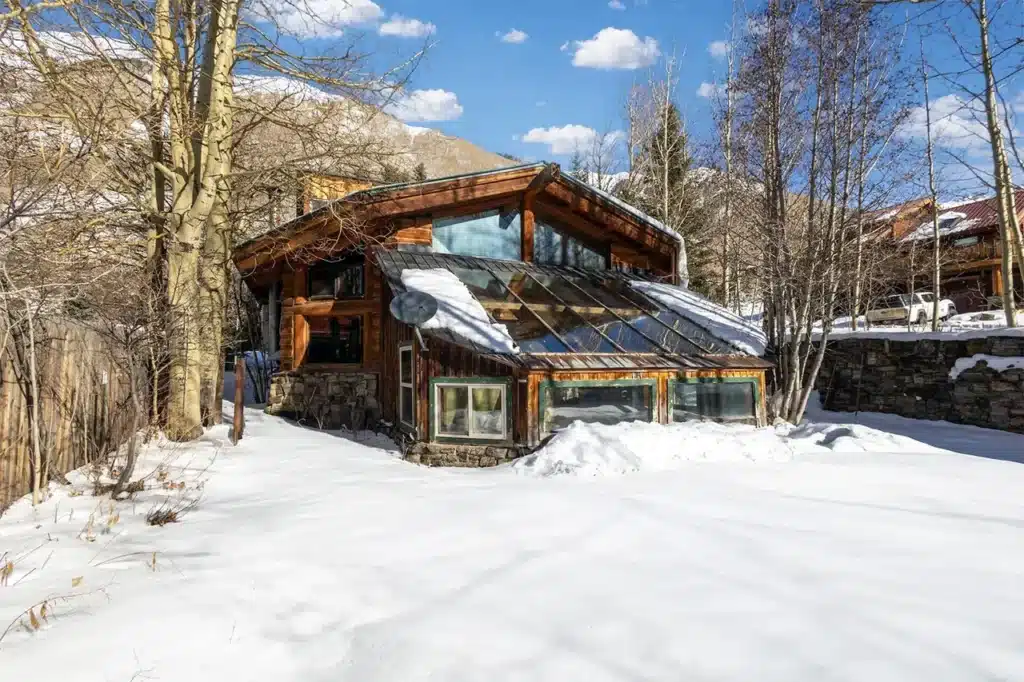Sunny winter exterior view of Shimkonis Partners Telluride area real estate listing, 34 Aurum Street, Ophir.