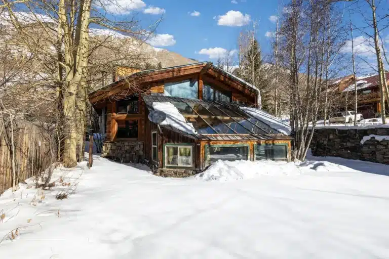 34 Aurum Street, Ophir Sunny winter exterior view of Shimkonis Partners Telluride area real estate listing, 34 Aurum Street, Ophir.