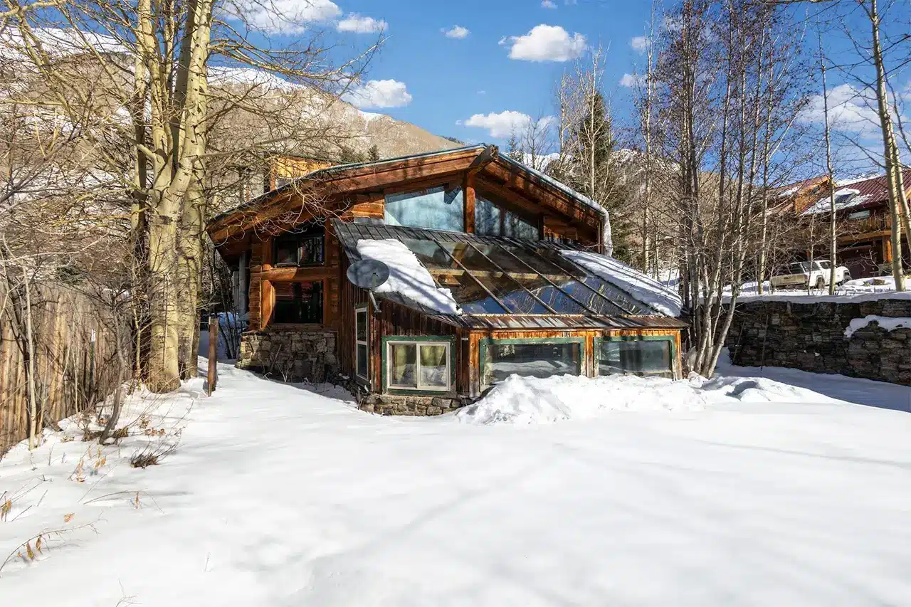 34 Aurum Street, Ophir Sunny winter exterior view of Shimkonis Partners Telluride area real estate listing, 34 Aurum Street, Ophir.