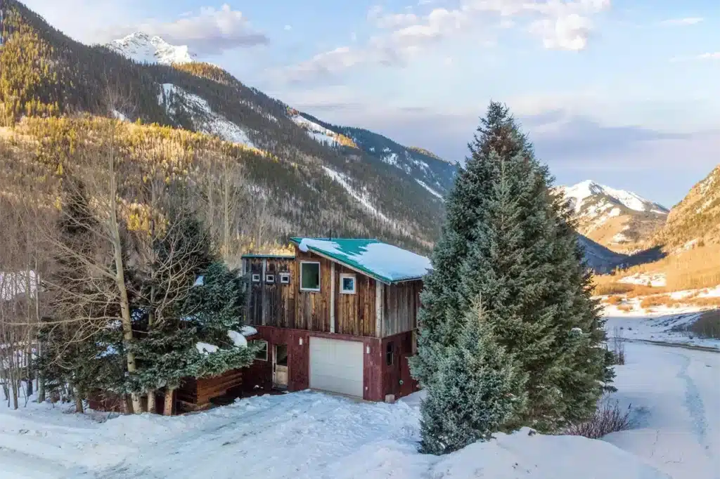 Sunny winter exterior view of Shimkonis Partners Telluride area real estate listing, 34 Aurum Street, Ophir.
