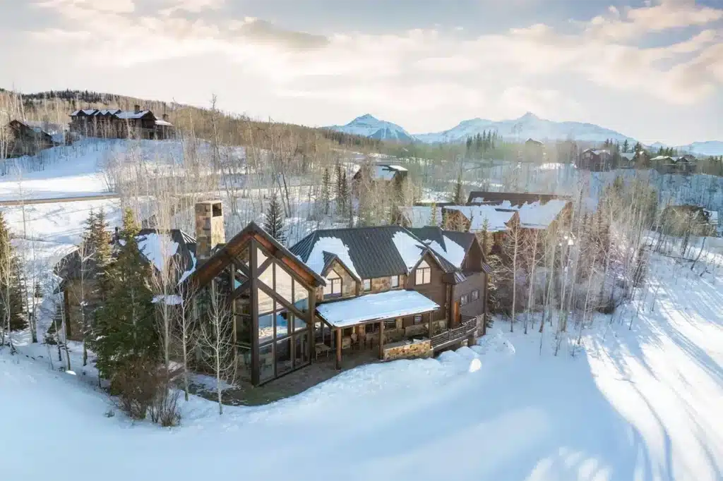 Sunny winter exterior view of Shimkonis Partners Telluride area real estate listing, 108 Lone Fir Lane, Mountain Village.