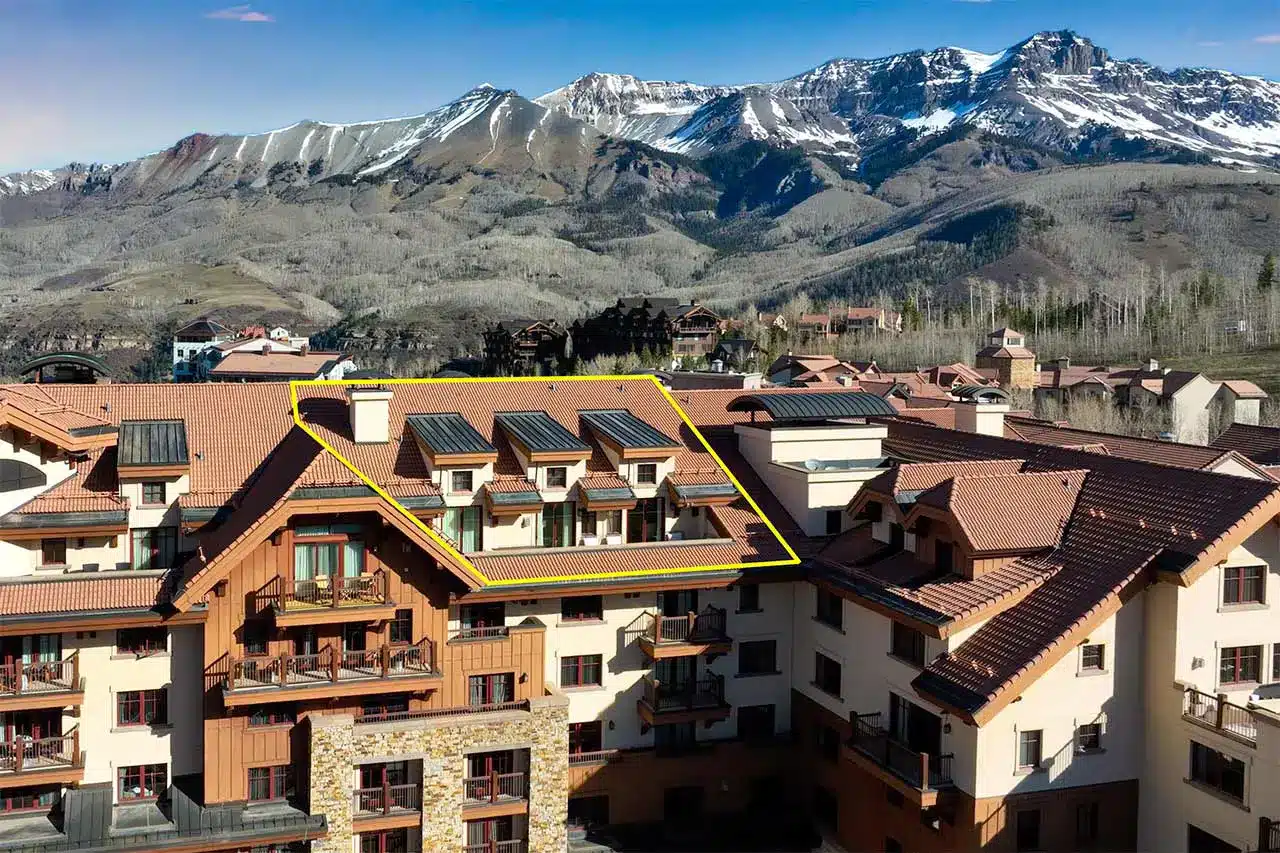 Madeline Residences 710, Mountain Village Shimkonis Partners real estate listing, Madeline Residences 710, Mountain Village, sunny building exterior with penthouse unit outlined