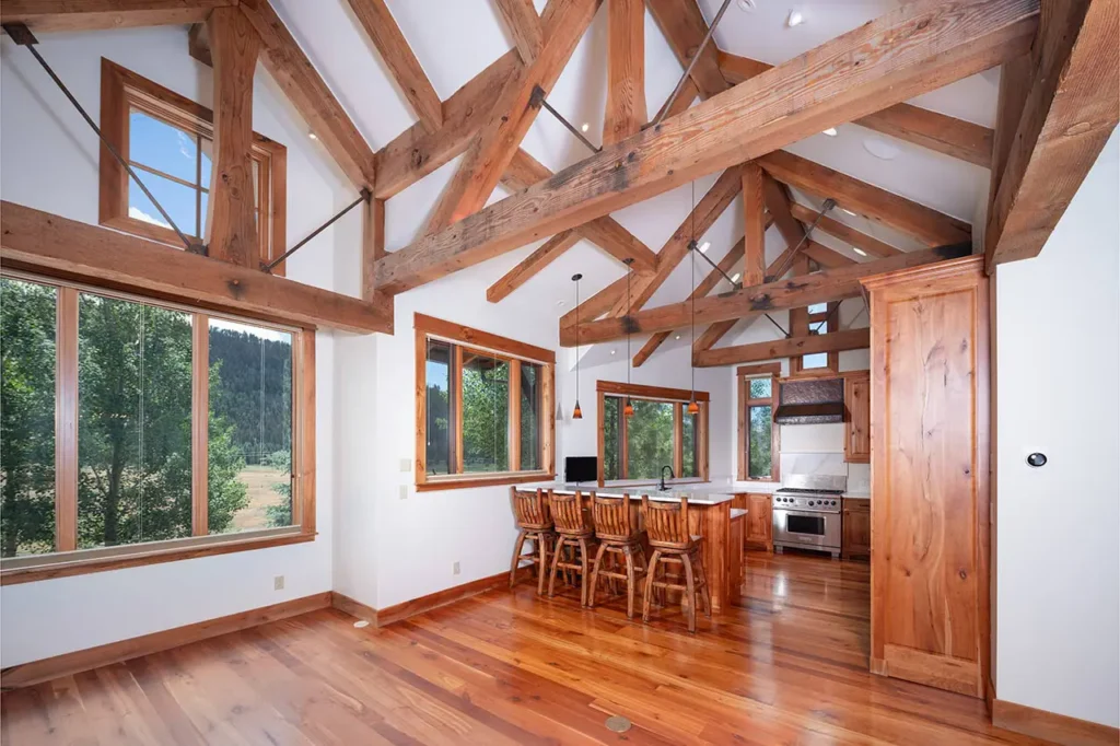 Shimkonis Partners Telluride real estate listing, 210 S Sunset Ridge, bright, airy interior living space with verdant, summer views