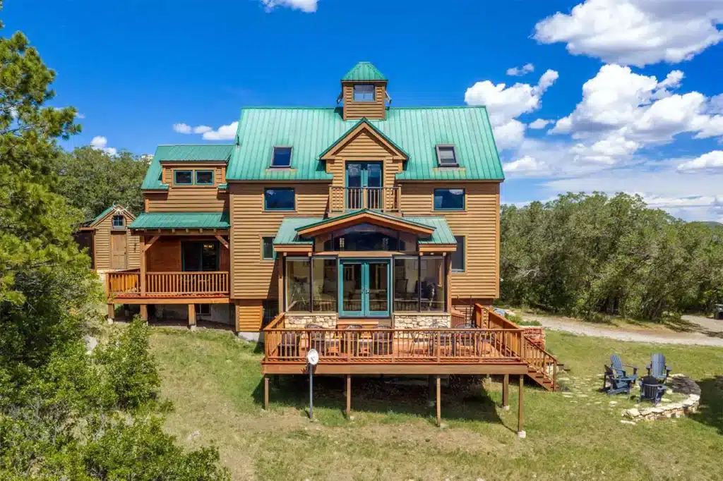 Sunny summer exterior view of Shimkonis Partners Telluride area real estate listing, 1075 High Plains Drive, Placerville