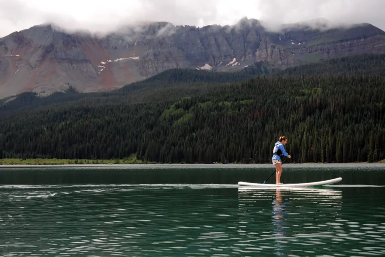 SUPing on Trout Lake, Colorado Lona paddleboarder enjoying an overcast outing on Trout Lake near Telluride, Colorado